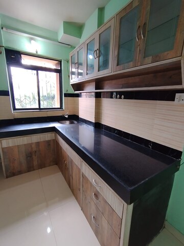 Kitchen in 1 BHK Apartment at Krishna Greenland Park Vastu Federation, Ghodbunder Road – for Sale