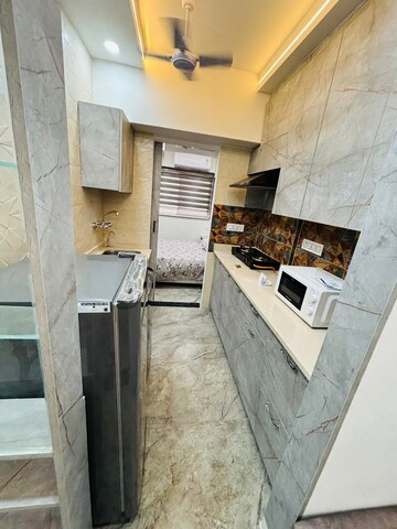 Kitchen in 1.5 BHK Apartment at Moti Nagar – for Rent