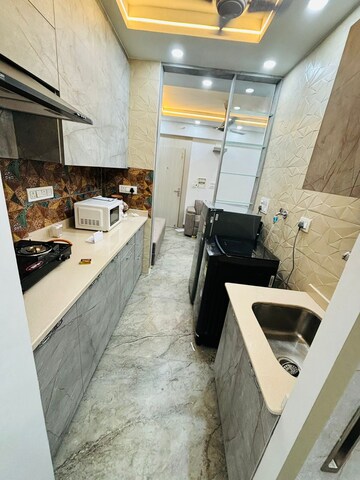 Kitchen in 1.5 BHK Apartment at Moti Nagar – for Rent