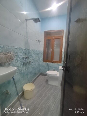 Bathroom in 1.5 BHK Builder Floor at Dwarka Mor – for Rent