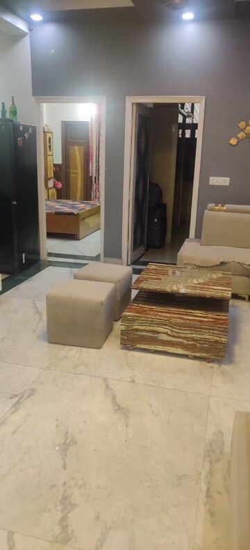 Living Room in 2 BHK Apartment at Saya Gold Avenue, Vaibhav Khand – for Rent