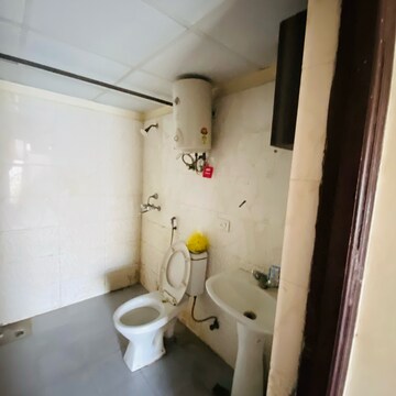 Bathroom in 2.5 BHK Apartment at Aims Golf City, Noida Central – for Rent