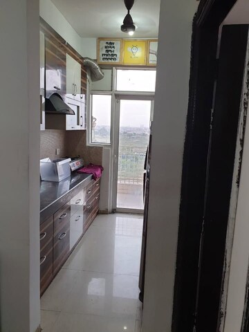 Kitchen in 3 BHK Apartment at Ajnara Homes, Sector 16b Greater Noida – for Rent