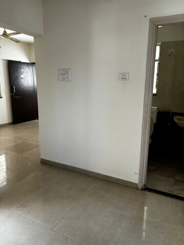 Living Room in 2 BHK Apartment at Jalan Aura County Pune, Wagholi – for Rent