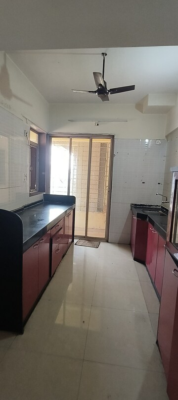 Kitchen in 3 BHK Apartment at Dweepmala Gauri Priya, Kharghar – for Rent
