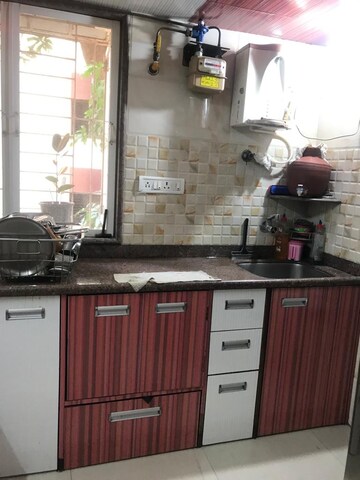 Kitchen in 2 BHK Apartment at Daffodil CHS Ganeshwadi, Ganeshwadi – for Sale