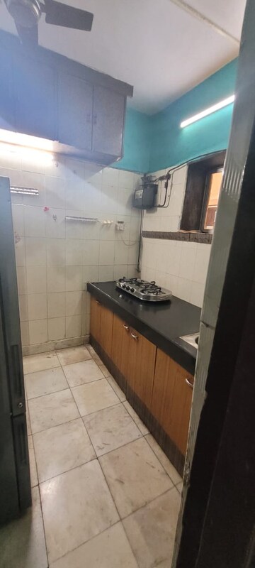 Kitchen in 1.5 BHK Apartment at Vasant Vihar – for Rent