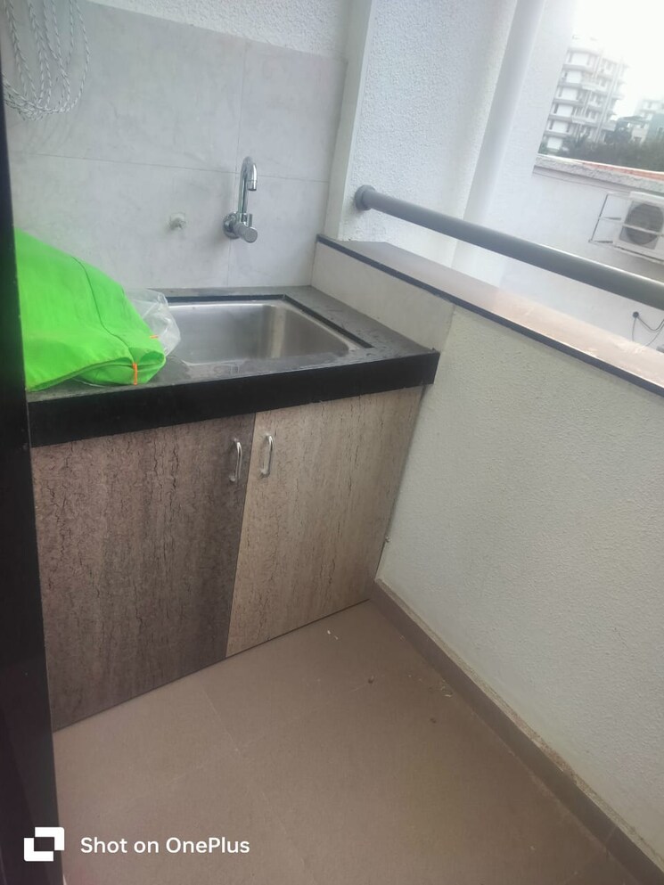 Kitchen, om-apartment-sus 2 Bedroom 930 Sq.Ft. Apartment In Sus Pune 7907408