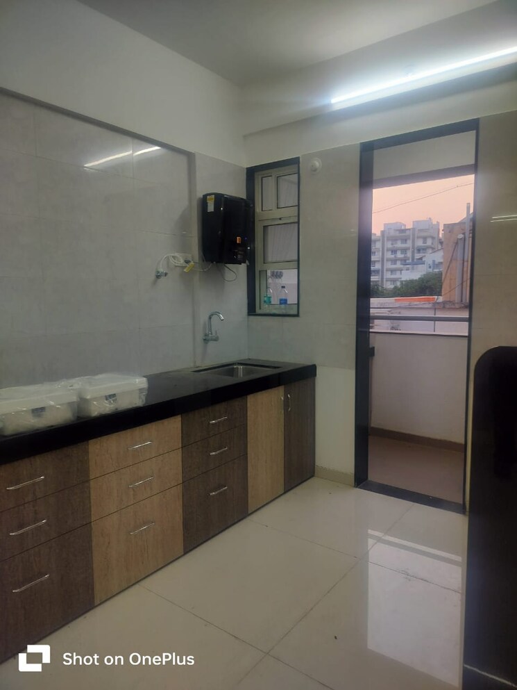 Kitchen, om-apartment-sus 2 Bedroom 930 Sq.Ft. Apartment In Sus Pune 7907408