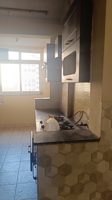 Kitchen in 2 BHK Apartment at Amrapali Silicon City, Sector 76 – for Rent