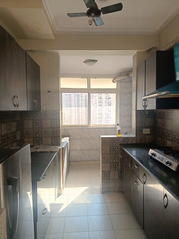 Kitchen in 2 BHK Apartment at Amrapali Silicon City, Sector 76 – for Rent