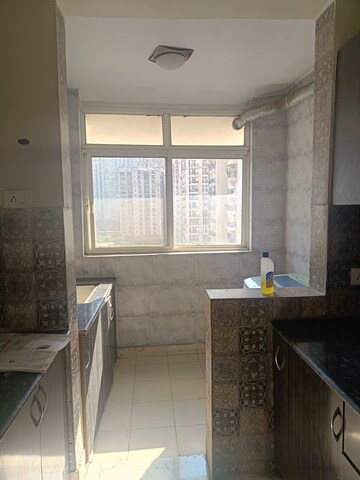 Kitchen in 2 BHK Apartment at Amrapali Silicon City, Sector 76 – for Rent