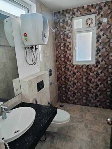 Bathroom in 2.5 BHK Apartment at Aims Golf City, Sector 75 – for Rent