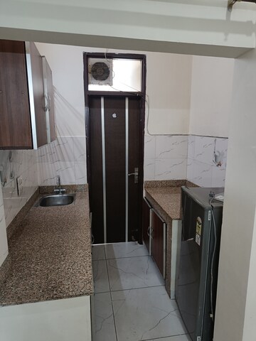 Kitchen in Studio Builder Floor at Ansal Sushant Lok I, Sector 43 – for Rent