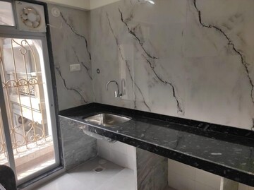 Kitchen in 1 BHK Apartment at Tharwani Vedant Nakshatra, Badlapur West – for Sale
