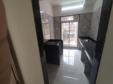 Kitchen in 1 BHK Apartment at Tharwani Vedant Nakshatra, Badlapur West – for Sale