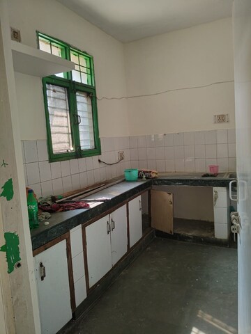 Kitchen in 3 BHK Apartment at Power Grid Residency, Sector 21c – for Rent
