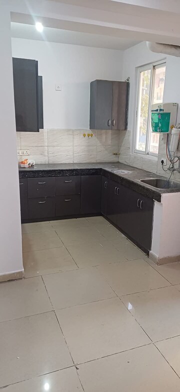 Kitchen in 2 BHK Apartment at Amrapali Golf Homes, Sector 4, Greater Noida – for Sale