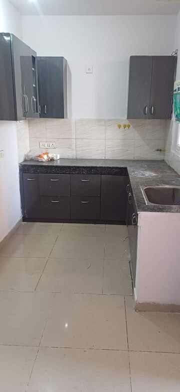 Kitchen in 2 BHK Apartment at Amrapali Golf Homes, Sector 4, Greater Noida – for Sale