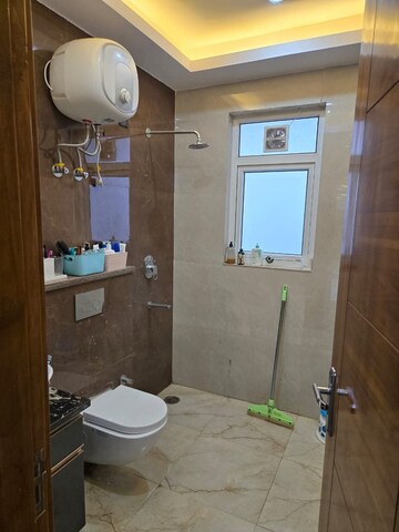 Bathroom in 3 BHK Builder Floor at Ansal Palam Triangle, Palam Vihar Extension – for Rent