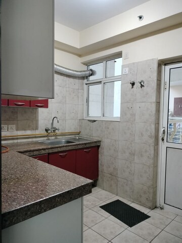Kitchen in 3 BHK Apartment at Great Value Sharanam, Sector 107 – for Sale