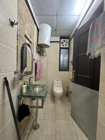 Bathroom in 3 BHK Builder Floor at Bharti Apartments, Shakti Khand iv – for Rent