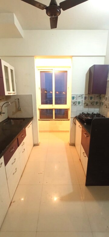 Kitchen in 3 BHK Apartment at Puranik Rumah Bali, Ghodbunder Road – for Sale