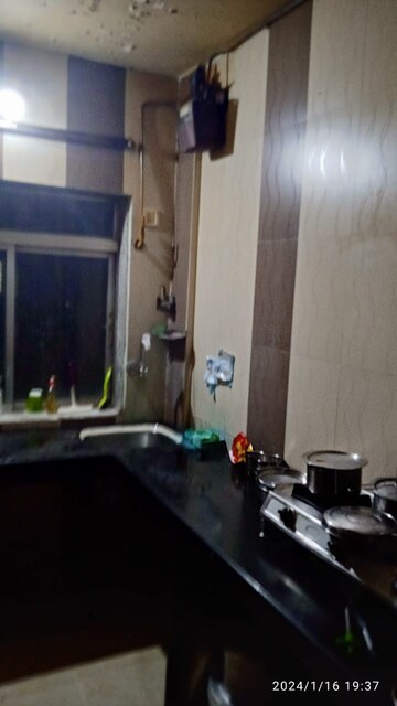 Kitchen in 2 BHK Apartment at Dheeraj Uphar CHS. LTD., Malad East – for Sale