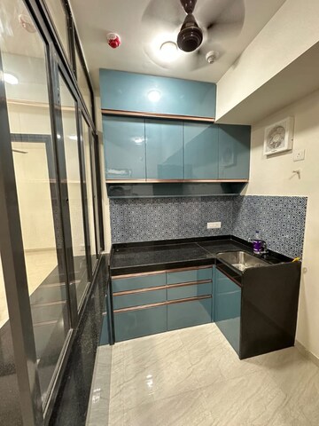 Kitchen in 2 BHK Apartment at Lodha Quality Home Tower 5, Balkum Pada – for Sale