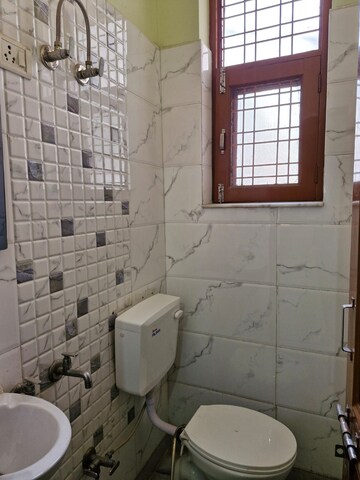 Bathroom in 3 BHK Builder Floor at Ansal Palam Triangle, Palam Vihar Extension – for Rent