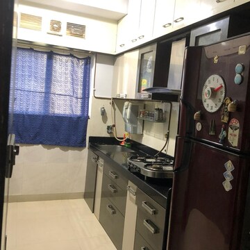 Living Room in 2 BHK Apartment at Rustomjee Athena, Majiwada – for Rent