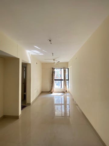 Living Room in 1 BHK Apartment at Lodha Crown Quality Homes Dombivli, Dombivli East – for Rent