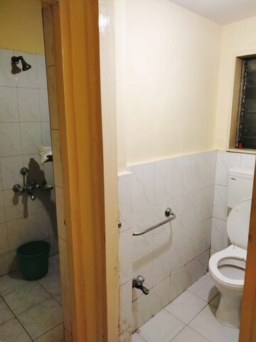 Bathroom in 1 BHK Apartment at Shubharambh Complex, Manpada – for Rent