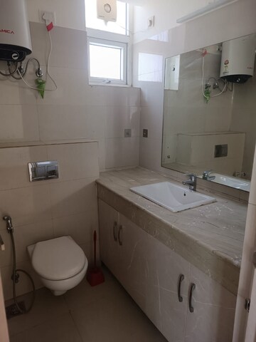Bathroom in 2 BHK Apartment at Emaar MGF The Palm Drive Studios, Sector 66 – for Rent