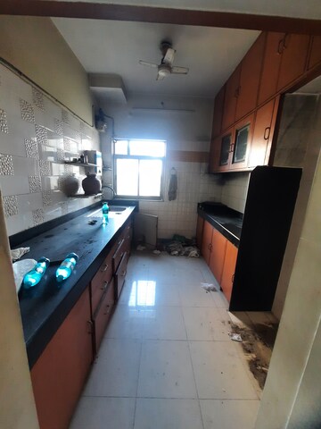 Kitchen in 2.5 BHK Apartment at Vijay Enclave, Waghbil – for Sale