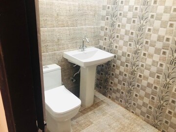 Bathroom in 3 BHK Apartment at Dhakoli Village – for Rent