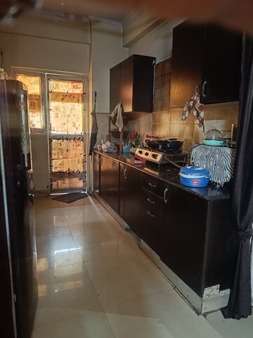 Kitchen in 2 BHK Apartment at Aims Golf City, Sector 75 – for Rent
