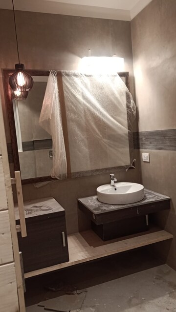 Bathroom in 4 BHK Builder Floor at DLF Plaza Tower, Sector 26a – for Rent