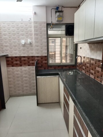 Kitchen in 2 BHK Apartment at Shree Tirupati STG Signature Residency, Ghodbunder Road – for Rent
