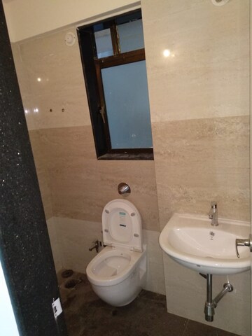 Bathroom in 2 BHK Apartment at Vijay Galaxy, Waghbil – for Rent