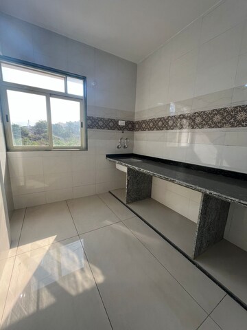 Kitchen in 2 BHK Apartment at Satyam Sheela, Badlapur East – for Sale