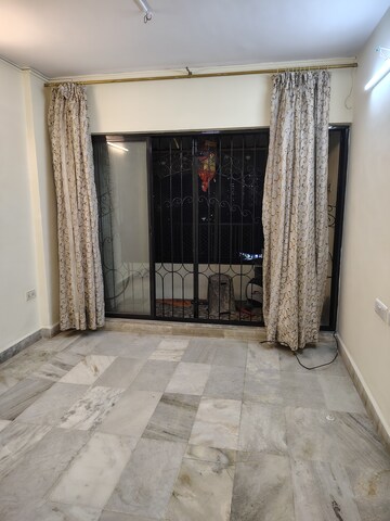 Bedroom in 2 BHK Apartment at Gaurav Garden I, Kandivali West – for Rent
