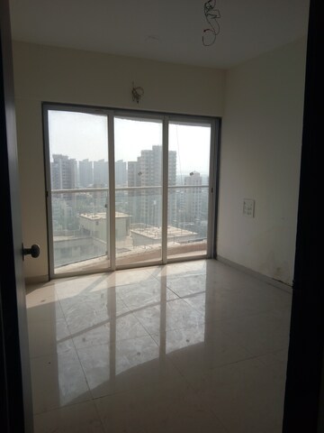 Living Room in 1 BHK Apartment at Lotus Lotus Link Square, Malad West – for Rent