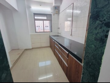 Kitchen in 2 BHK Apartment at Vardhman Gardens, Balkum Pada – for Rent