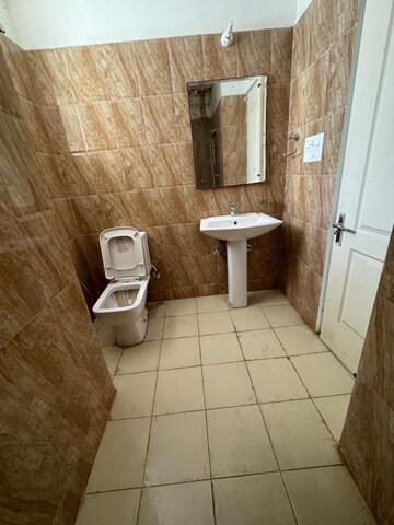 Bathroom in 3 BHK Apartment at Sushma Elite Cross, Dhakoli Village – for Sale