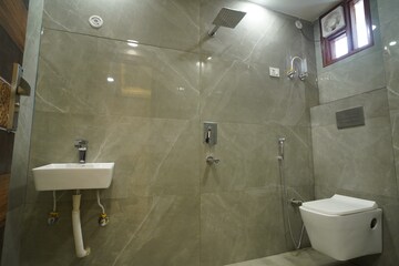 Bathroom in 4 BHK Apartment at Bhagwati Garden – for Sale