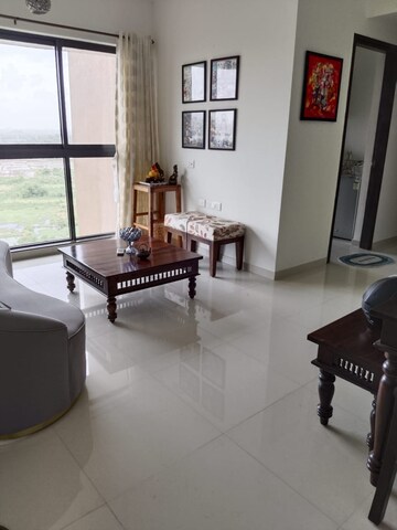 Living Room in 2 BHK Apartment at Lodha Splendora River View, Ghodbunder Road – for Rent