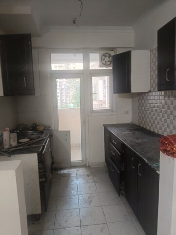 Kitchen in 2 BHK Apartment at Amrapali Silicon City, Sector 76 – for Rent