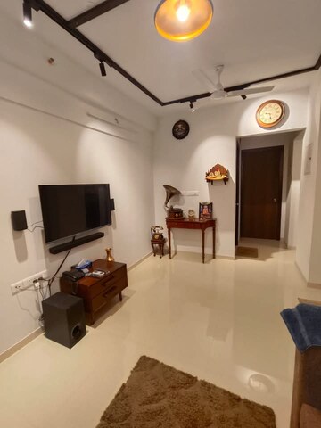 Living Room in 1 BHK Apartment at Lodha Downtown, Dombivli East – for Rent