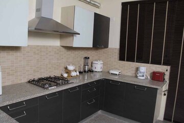 Kitchen in 4 BHK Apartment at Raheja Shilas, Sector 109 – for Sale